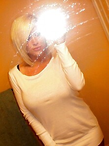 Monroe Lee Takes Off Her White Sweater In The Mirror.