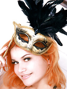 Redhead Takes Off Her Carnival Mask Along With The Rest Of Her O