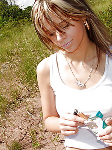 Ann Angel Having A Cigarette In Field