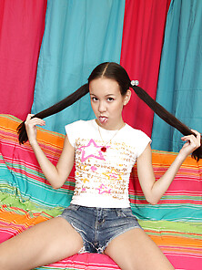 Young Asian Coed Has Long Pigtails To Grab Them During Passionat