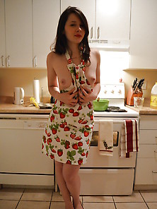 Girl In Apron Baking In The Kitchen