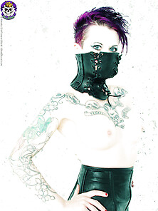 Tattooed Goth Girl In Restrictive Corset
