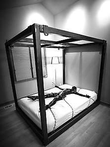 Latex Toy Chained To Bed
