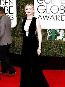 Kirsten Dunst Shows Cleavage In A Black Dress