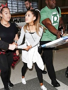 Ariana Grande Spotted At Lax In A Black And Gray Outfit