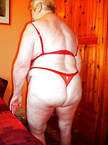 Granny Posing In Red Lingerie