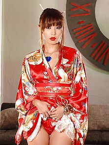 Exotic Geisha Seductively Poses In Living Room While Waiting For