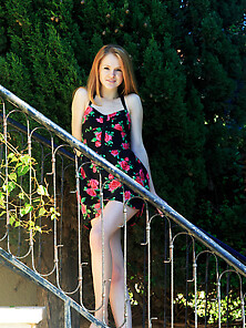 Teen Redhead Starts Taking Dress Off On The Stairs And Poses Nud