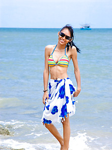 Leggy Ts Posing In Stripy Bikini On The Beach