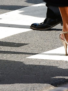 Crossing Road On Heels By Mature