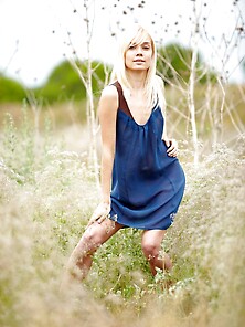 Fair-Haired Model With A Shapely Ass Posing In A Grassy Field Vi