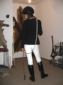 Riding Mistress In Riding Clothes And With Whip