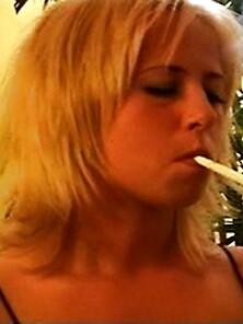 Marvelous Blonde Chick In Black Enjoys Smoking